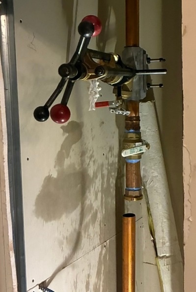 2-inch line stop installed on copper pipe for valve insertion