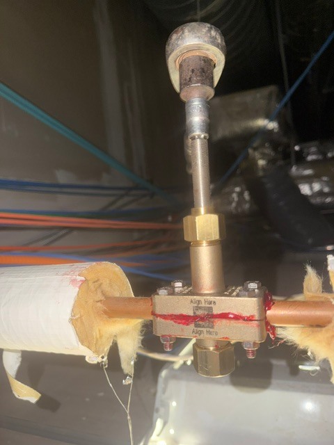 Add-A-Valve installed on copper water line for live valve insertion — Mickie Service Company